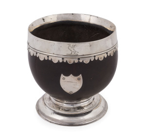 A Georgian silver mounted coconut bowl with shield plaque and griffin crest, 18th/19th century, 10.5cm high