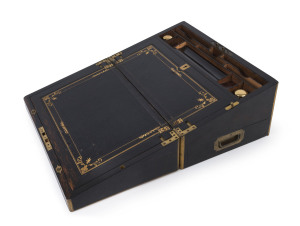 A fine antique travelling writing box, brass bound coromandel with mahogany fitted interior, embossed and gilt tool leather slope and original silver gilt inkwells. Also includes a secret compartment, mid 19th century, 22cm high, 45cm wide, 28cm deep
