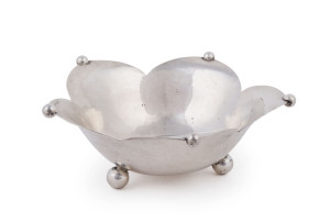 A fine Dutch Art Deco sterling silver bowl of petal flower form with bead decoration to the petal tips, standing on 3 ball feet, marked to the underside "J. STELTMAN" (Johannes Steltman), date letter D for 1935, Minerva head duty mark, lion passant, and S for the workshop silver smith, circa 1935, 5cm high, 13cm wide, 94 grams