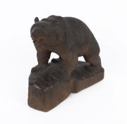 A Black Forest carved wooden bear statue, 19th century, ​31cm high