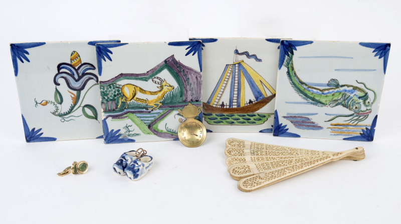 An antique carved bone fan, pair of cufflinks, tea caddy spoon, Delft porcelain clog ornaments and four Spanish tiles (10 items), the fan 18cm high