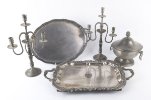 A pair of pewter candelabra, pewter terrine and two serving trays, (5 items), the candelabra 44cm high