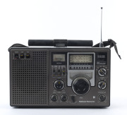 National Panasonic DR22 FR-2200BS portable mains/battery radio, with carry straps, late 1970s. 19cm high, 32cm wide.