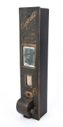 TOBACCIANA: "Sylent Wurker" cigarette machine, patented by Person Jepson of Melbourne (1923), bronze fascia with inset mirror; height 66cm high, 13.5cm wide, 11.5cm deep. In original condition (with key). A rare survivor.