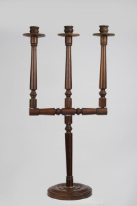 An antique Spanish three branch candelabra, turned walnut, 18th/19th century, ​94cm high