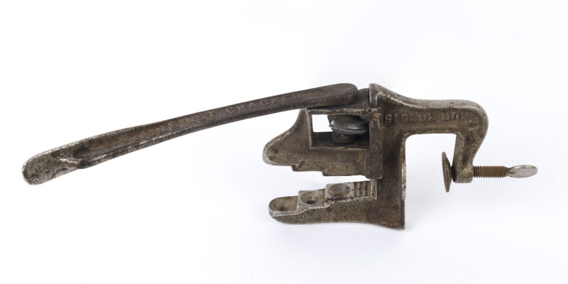 A bench mount nut cracker marked "ST. LOUIS U.S.A.", early 20th century, ​30cm high