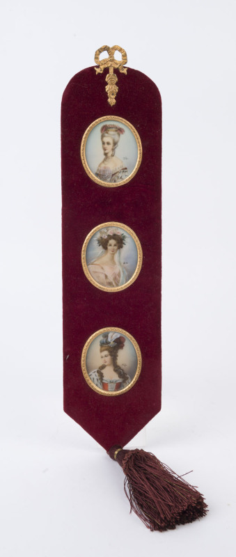 A set of three miniature portraits mounted in burgundy velvet and ormolu, 20th century, ​55cm high overall