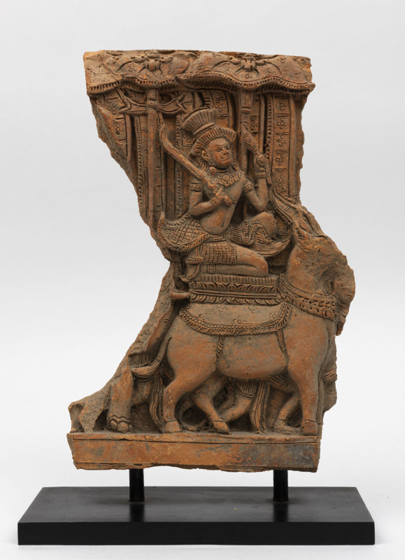 A Burmese terracotta sculptural fragment on stand, 16th/17th century, ​34cm high, 22cm wide