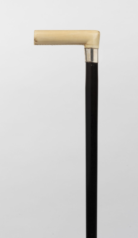 An antique walking stick, carved ivory handle, silver collar, ebony shaft with brass ferrule, 19th century, ​83cm high