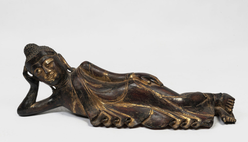 A Thai reclining Buddha, gilt finish terracotta, 20th century, 106cm long