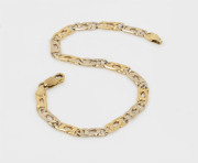 A 9ct gold bracelet with two tone links, stamped "375", 21cm long, 9.5 grams