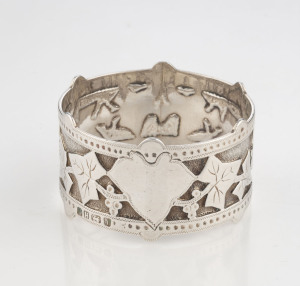 An antique English sterling silver napkin ring adorned with ivy motif (I cling to thee), and vacant cartouche, in original leather case, marked for Sheffield, circa 1872. ​4.5cm diameter, 29 grams