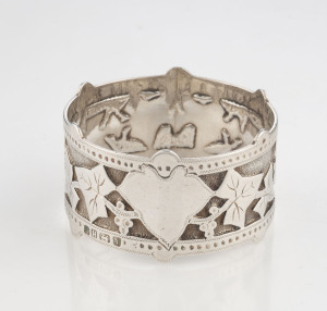 An antique English sterling silver napkin ring adorned with ivy motif (I cling to thee), and vacant cartouche, in original leather case, marked for Sheffield, circa 1872. 4.5cm diameter, 29 grams