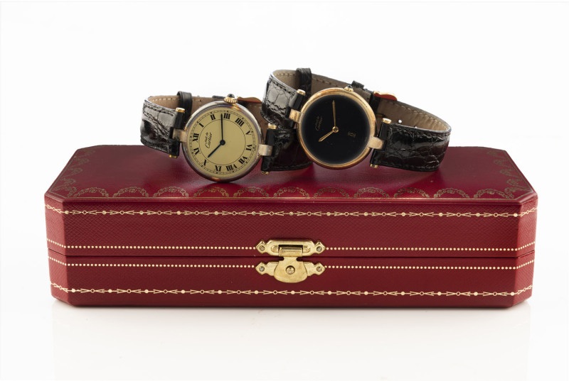 CARTIER: two gents wristwatches with quartz movements and sapphire crowns, in Cartier branded boxes.