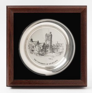 "The University of Melbourne" sterling silver commemorative plate designed by Kenneth Jack for Franklin Mint (1979), mounted, framed & glazed. The plate 20cm diameter.