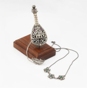 Two sterling silver necklaces and a silver lute ornament set with rubies, 20th century, (3 items), ​the lute 9.5cm long