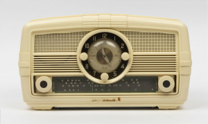 AWA mantel radio clock in ivory plastic case, ​19cm high, 35cm wide