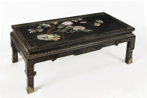 A Chinese coffee table, ebonised finish with painted highlights and inlaid stone top, late 20th century, missing glass, ​44cm high, 110cm wide, 61cm deep