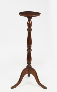 A reproduction mahogany pedestal with brass claw feet, 20th century, 99cm high, top 29cm diameter