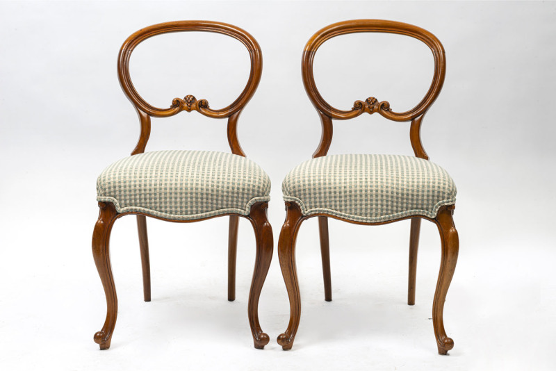 A pair of antique English carved walnut balloon back dining chairs with green and check upholstered seats, 19th century