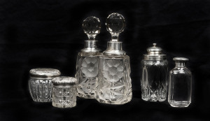 Six assorted English sterling silver mounted crystal vanity bottles, 19th and 20th century, the largest 18cm high