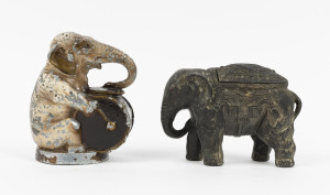 Two American cast metal elephant money boxes, circa 1920, the taller 12cm high.