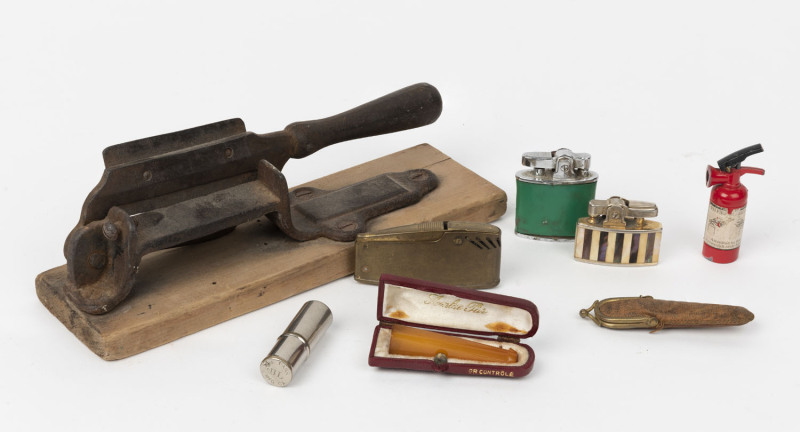 TOBACCIANA: Tobacco cutter, cigarette lighters and cigarette holders, 19th and 20th century. ​The tobacco cutter 24cm long