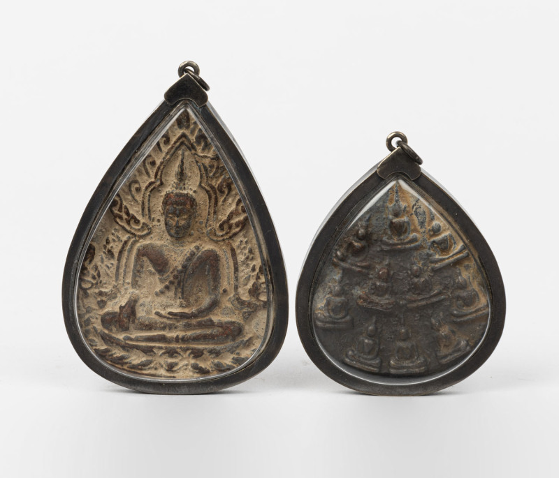 Two antique Indian terracotta Buddhist plaques in later silver mounted pendants,15th century, ​6.5cm high and 7.5cm high