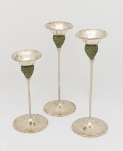 Set of three sterling silver candlesticks with green crystalline glass decoration, circa 1970, stamped 925 with pictorial marks, the largest 26.5cm high
