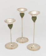 Set of three sterling silver candlesticks with green crystalline glass decoration, circa 1970, stamped 925 with pictorial marks, the largest 26.5cm high