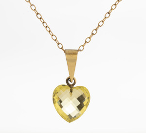 A heart shaped faceted peridot pendant on an Edwardian 9ct gold chain, ​40cm long