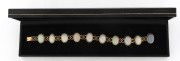 An impressive 18ct yellow gold bracelet set of 10 solid cabochon opals, early 20th century, 20cm long