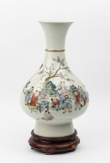 A 20th century Chinese porcelain hand-painted vase on timber table stand, signed to the base, 46cm high
