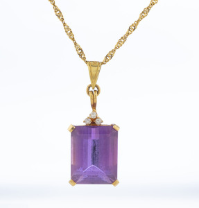 A 14ct gold and amethyst pendant set with three diamonds on a 14ct gold chain, stamp "14K, 585", 48cm long