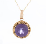 A 14ct rose gold and amethyst circular pendant on later gold chain, 53cm long