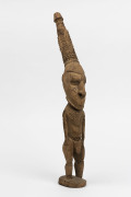 A tribal figure carved wood, Sepik River, Papua New Guinea, 20th century, 43cm high