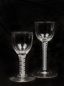 Two antique air twist stem glasses, 18th/19th century, 13cm and 15cm high