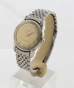 OMEGA "Seamaster", gentleman's wristwatch with automatic movement, off white dial with baton and Arabic numerals in a steel case and wrist band, with original "OMEGA" display stand, circa 1965