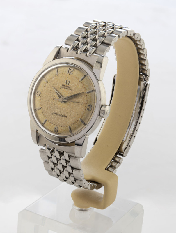 OMEGA "Seamaster", gentleman's wristwatch with automatic movement, off white dial with baton and Arabic numerals in a steel case and wrist band, the case back marked "Seamaster", "waterproof" and owners initials "P.J.M 13/1/61", with original "OMEGA" disp