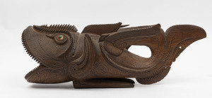 An impressive carved wooden fish studded with trade beads and shell eyes (one missing), Trobriand Islands, South Eastern Papua New Guinea, early 20th century, 63cm long