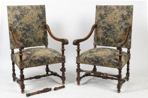 A pair of antique French carved walnut armchairs upholstered with blue floral tapestry, 19th century, 66cm across the arms