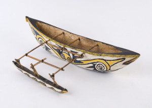Pacific Islands miniature canoe with painted finish, mid 20th century, ​44.5cm long