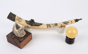 A bone opium pipe, antler ornament and a billiard ball, (3 items), the pipe 38cm long