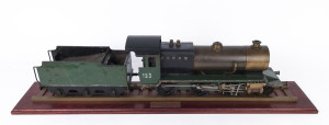 'DYAK' 2-6-0 LOCOMOTIVE AND TENDER: 2.5 inch gauge model of c.1938 steam locomotive built to LBSC design, copper boiler and fittings including water and pressure gauges, length (with tender) 80cm, weight 13kg; accompanied by a wooden display board with tr
