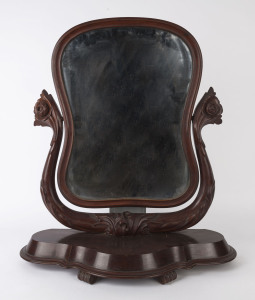 An antique mahogany toilet mirror with carved floral decoration, 19th century, 85cm high, 70cm wide, 27cm deep