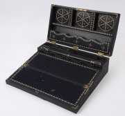 An Anglo-Indian writing box, ebony with reeded decoration, interior fitted with compartment and slope and decorated with dot ivory inlay, early to mid 19th century, 12.5cm high, 38cm wide, 21deep