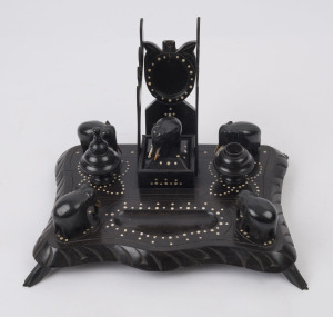 An Indian carved ebony desk set with ivory dot inlay and carved elephants, 19th century, 19cm high, 30cm wide, 21cm deep