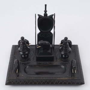 An Indian carved ebony desk set with incised and carved decoration, 19th century, 19cm high, 26cm wide, 19cm deep