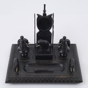 An Indian carved ebony desk set with incised and carved decoration, 19th century, ​19cm high, 26cm wide, 19cm deep