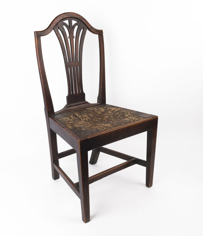 A Georgian Hepplewhite dining chair, elm and oak with drop-in rush seat, 18th century, 97cm high, 52cm wide